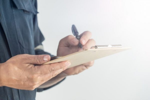 mechanic writes inspection report industrial maintenance 117358 117